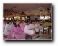 The sisters enjoying the bhajans - Click to enlarge