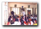 Brother Rajesh doing Aarathi during bhajans in Parthi - Click to enlarge